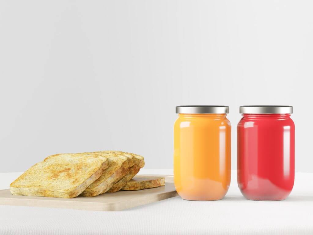 Strawberry jam and orange jam in a jar with toast