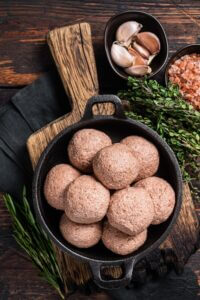 Meatless Vegetarian meatballs from raw plant based meat with thyme and rosemary.
